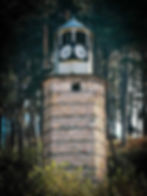The old clock tower with two dials in the town of Rakitovo