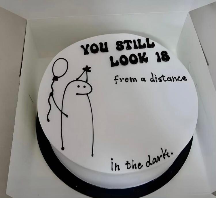 Bespoke single-tier celebration cake with elegant white icing and delicate floral decorations in Solihull, West Midlands.