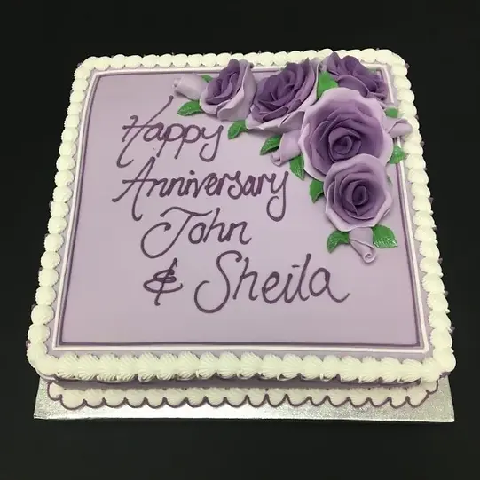 Bespoke cake with tricolour purple roses decoration, crafted for celebration in Solihull, West Midlands.