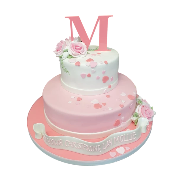 Bespoke celebration cake in Solihull, West Midlands with confetti hearts, a letter topper, and pink rose decorations.