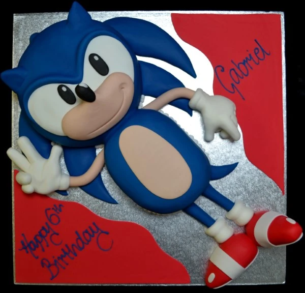 Bespoke Sonic the Hedgehog celebration cake with vibrant blue icing and character details in Solihull, West Midlands.