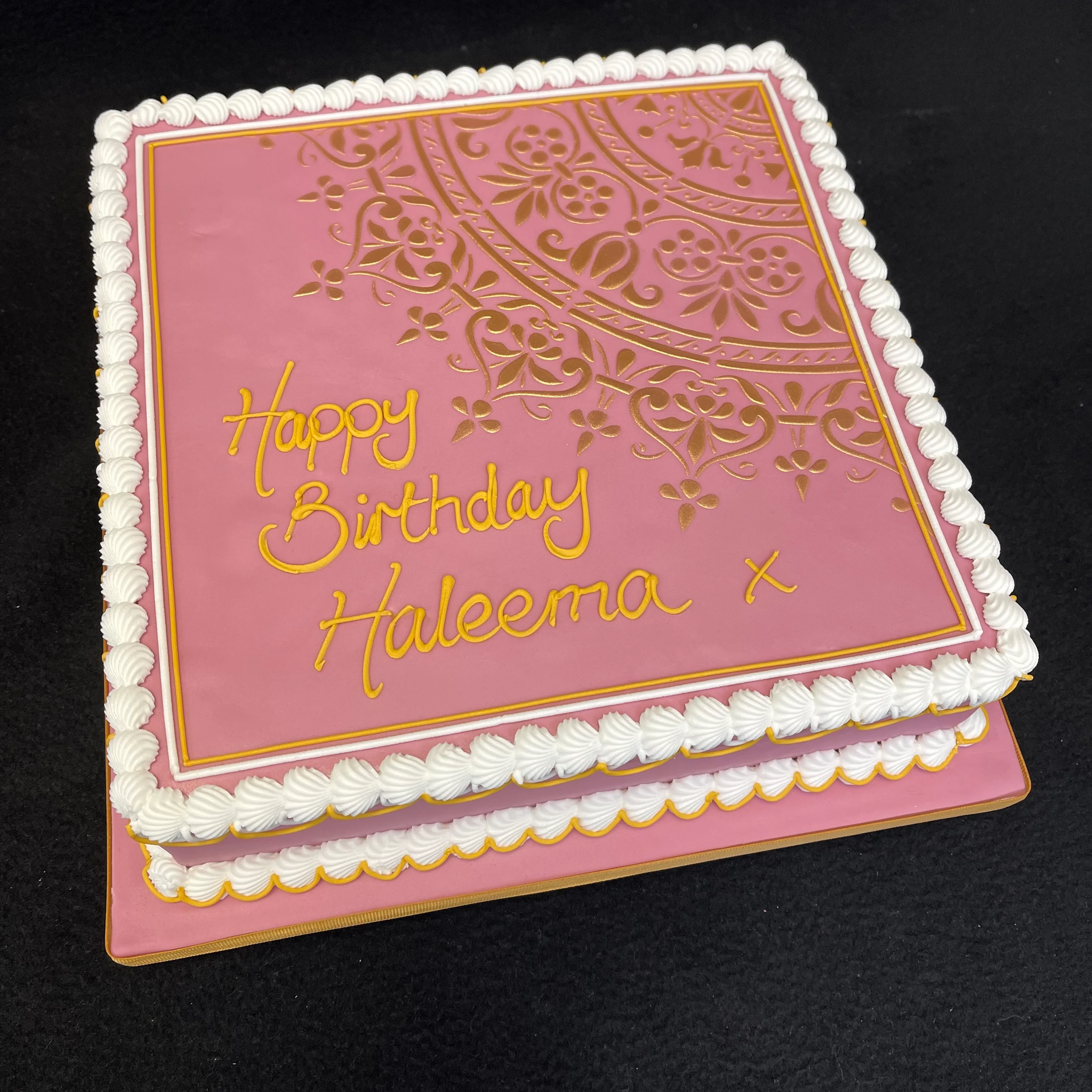 Bespoke celebration cake with intricate mandala pattern in vibrant colors, crafted in Solihull, West Midlands.