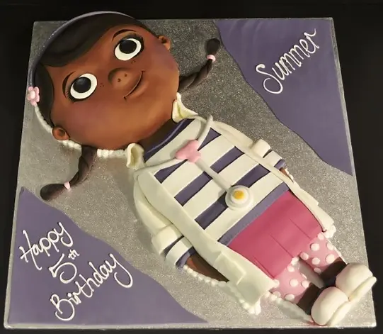 Bespoke Doc McStuffins cake with colorful fondant decorations in Solihull, West Midlands celebration.