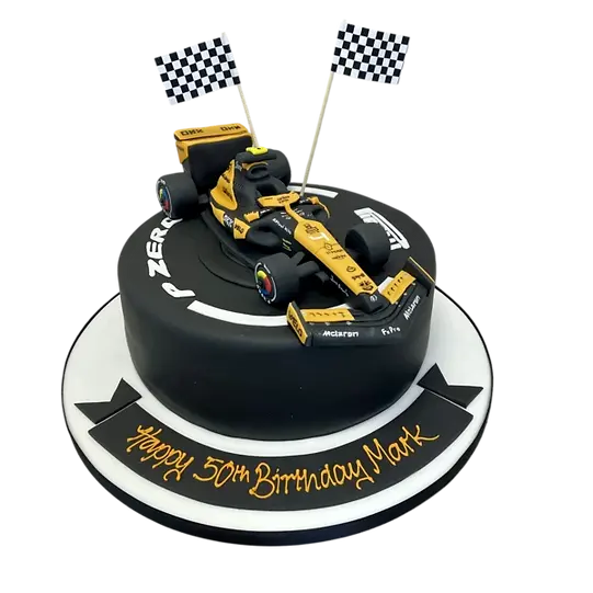 Bespoke Lando Norris McLaren F1 racing car cake with detailed orange and blue design in Solihull, West Midlands.