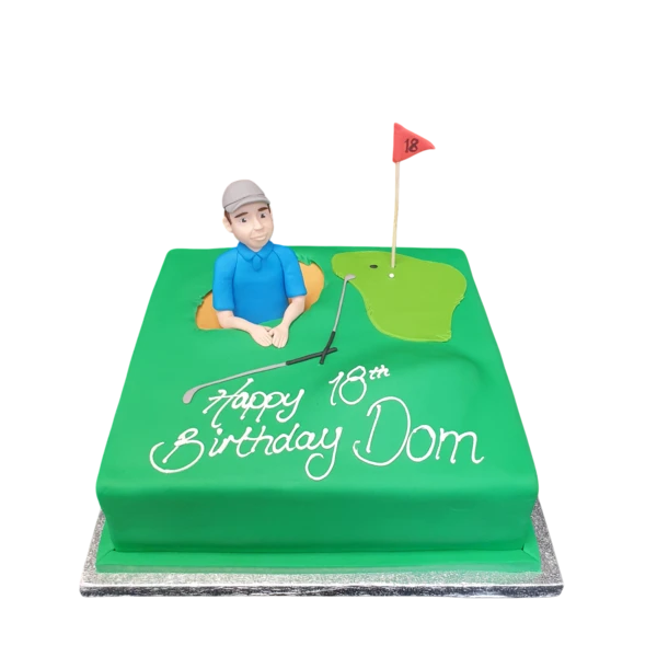 Bespoke celebration cake in Solihull, West Midlands featuring a golfer figure in a sand bunker with detailed greens.