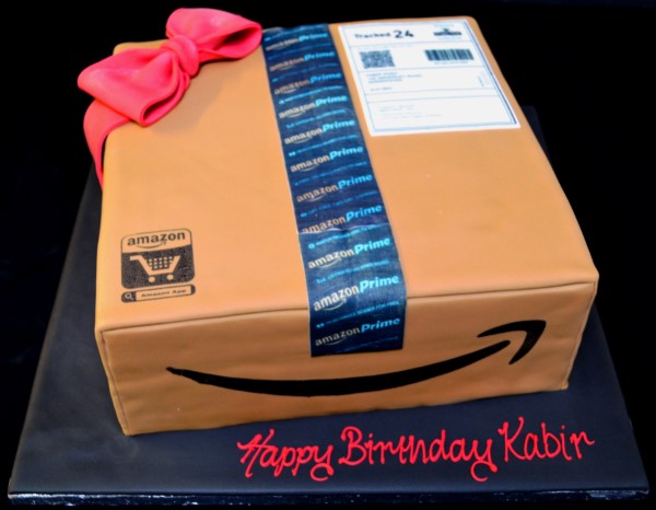 A beautifully decorated 12" cake resembling an Amazon delivery box, perfect for any celebration or themed party.