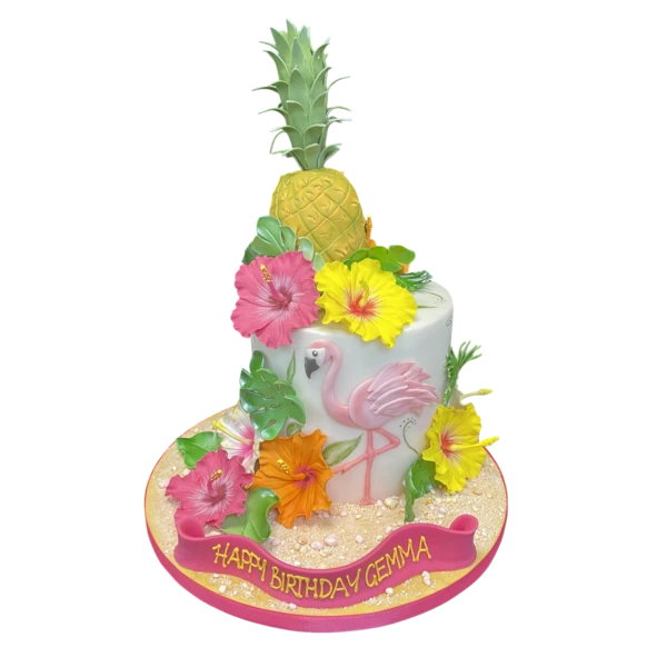 Bespoke celebration cake in Solihull, West Midlands featuring tropical pineapple, pink flamingo, and hibiscus decorations.