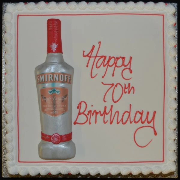 Bespoke celebration cake in Solihull, West Midlands featuring a detailed vodka bottle atop a square base.
