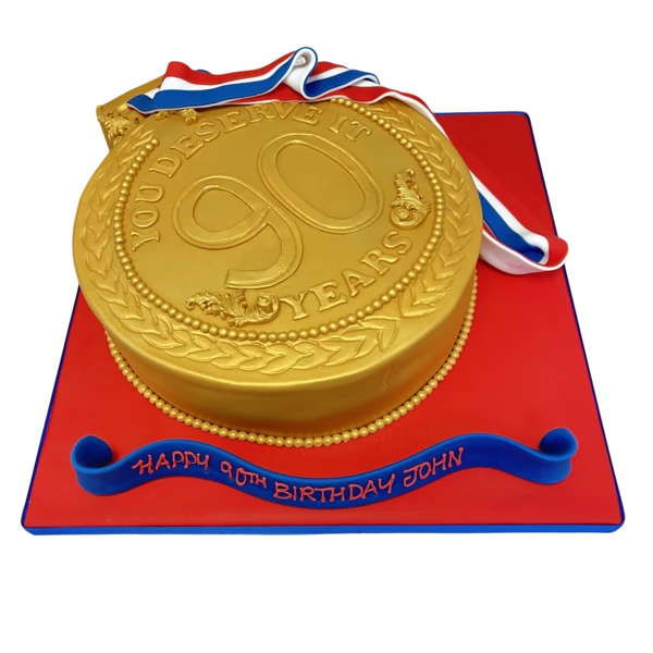 A decadent gold medal themed cake with intricate detailing and elegant design, perfect for celebratory occasions and special events.