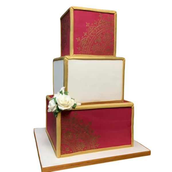 Three-tiered wedding cake with crimson and gold sugar paste, adorned with white roses.