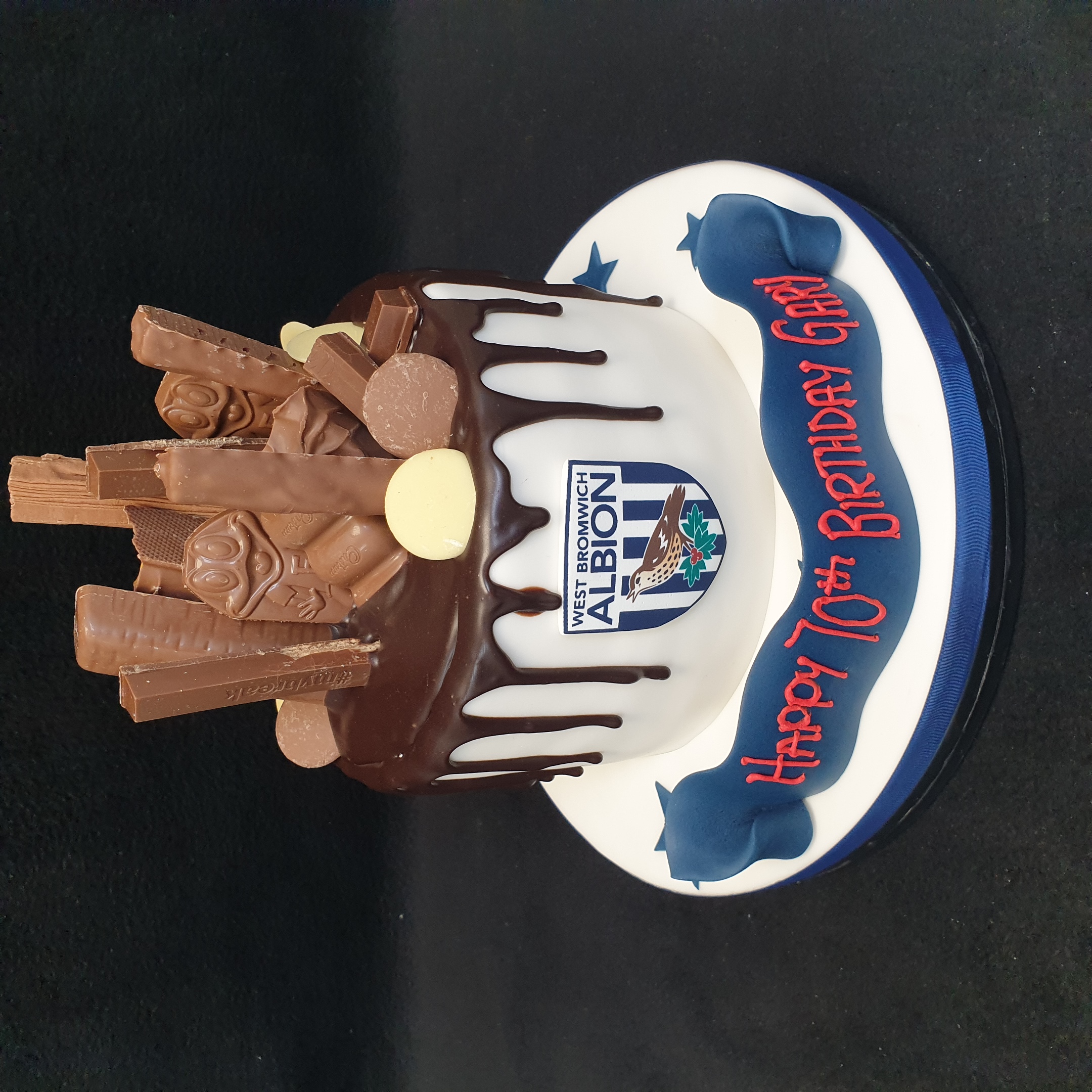 Bespoke chocolate football-themed cake with edible goalposts and a soccer ball, crafted in Solihull, West Midlands.