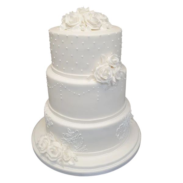 Three-tier white wedding cake with sugar roses and pearl accents.