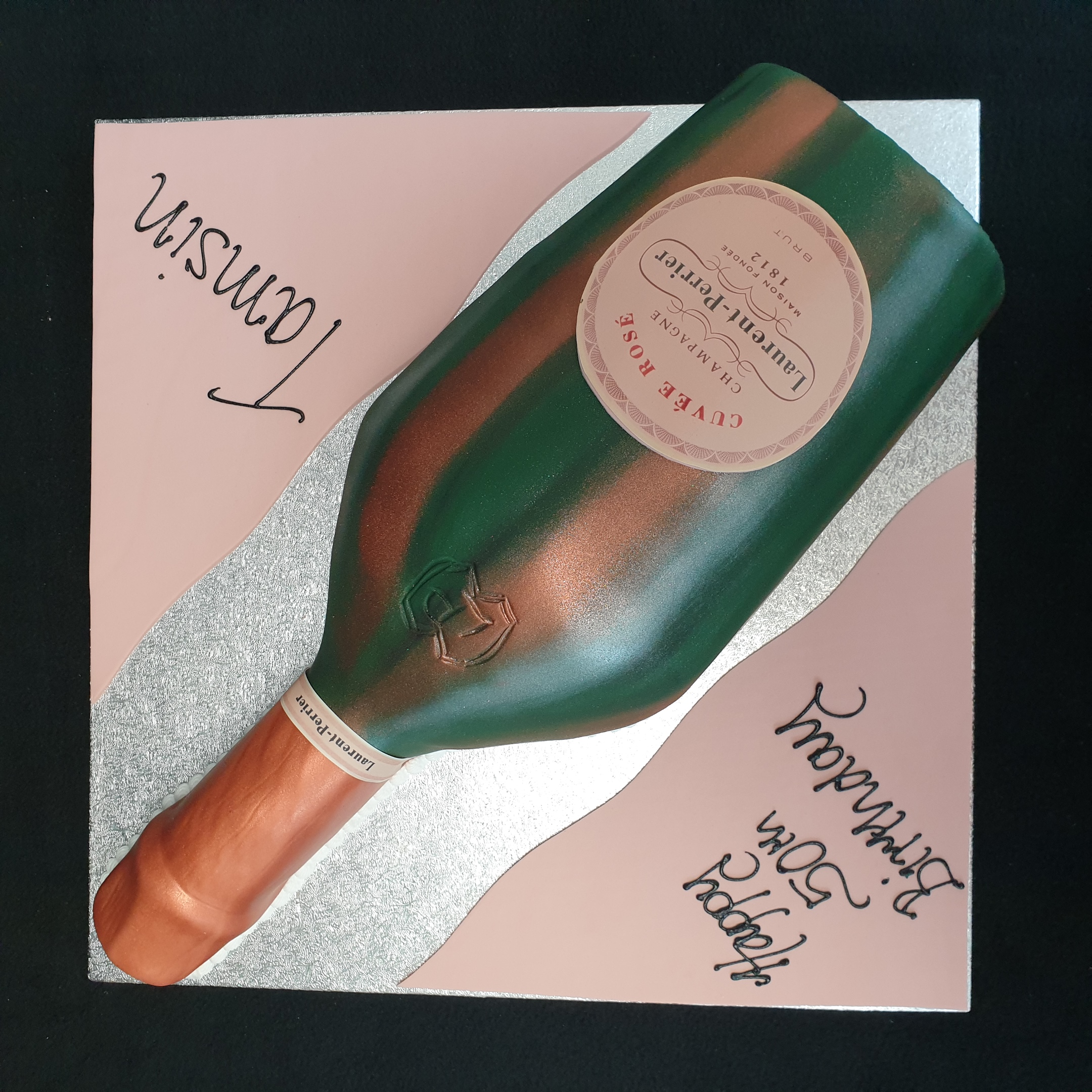 Bespoke Laurent Perrier Rose Champagne celebration cake with elegant pink and gold accents in Solihull, West Midlands.