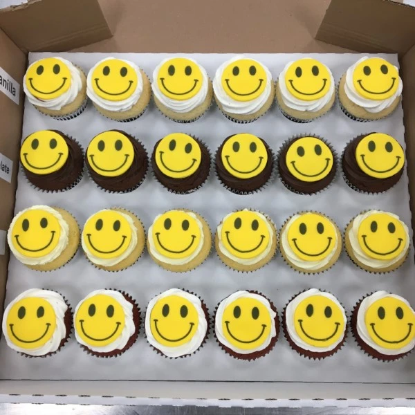 Bespoke smiley acid face cupcakes with vibrant colors, perfect for celebration in Solihull, West Midlands.