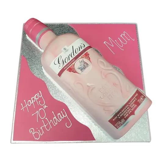 Bespoke Gordons Pink Gin cake with pink frosting and elegant floral decorations in Solihull, West Midlands.