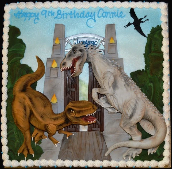 Bespoke large square cake with Jurassic World dinosaur scene, detailed decoration in Solihull, West Midlands.
