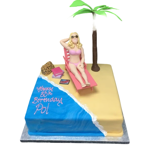 Bespoke cake featuring a lounging figure on a sandy beach scene, crafted for celebration in Solihull, West Midlands.