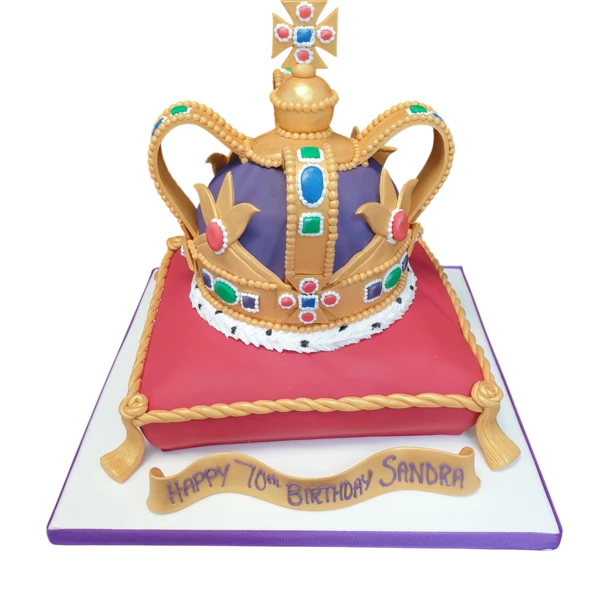 Bespoke cake featuring a detailed crown resting on a cushion, perfect for a celebration in Solihull, West Midlands.