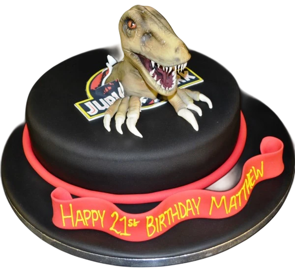 Bespoke Velociraptor Jurassic Park cake with detailed dinosaur figure and jungle foliage, Solihull, West Midlands.