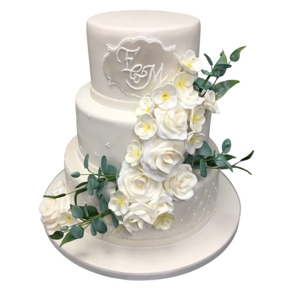 Three-tier wedding cake with white sugar paste, roses, and greenery.