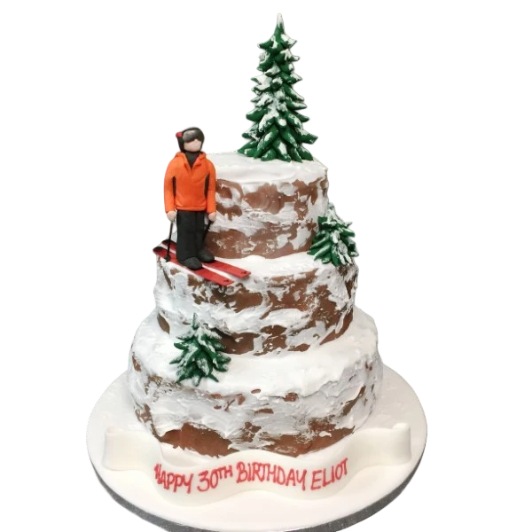 Bespoke cake featuring a cliff skiing backcountry drops design with snowy mountain details, Solihull, West Midlands.