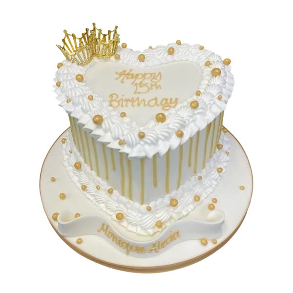 Bespoke celebration cake with intricate piping, chocolate drip, and edible crowns in Solihull, West Midlands.