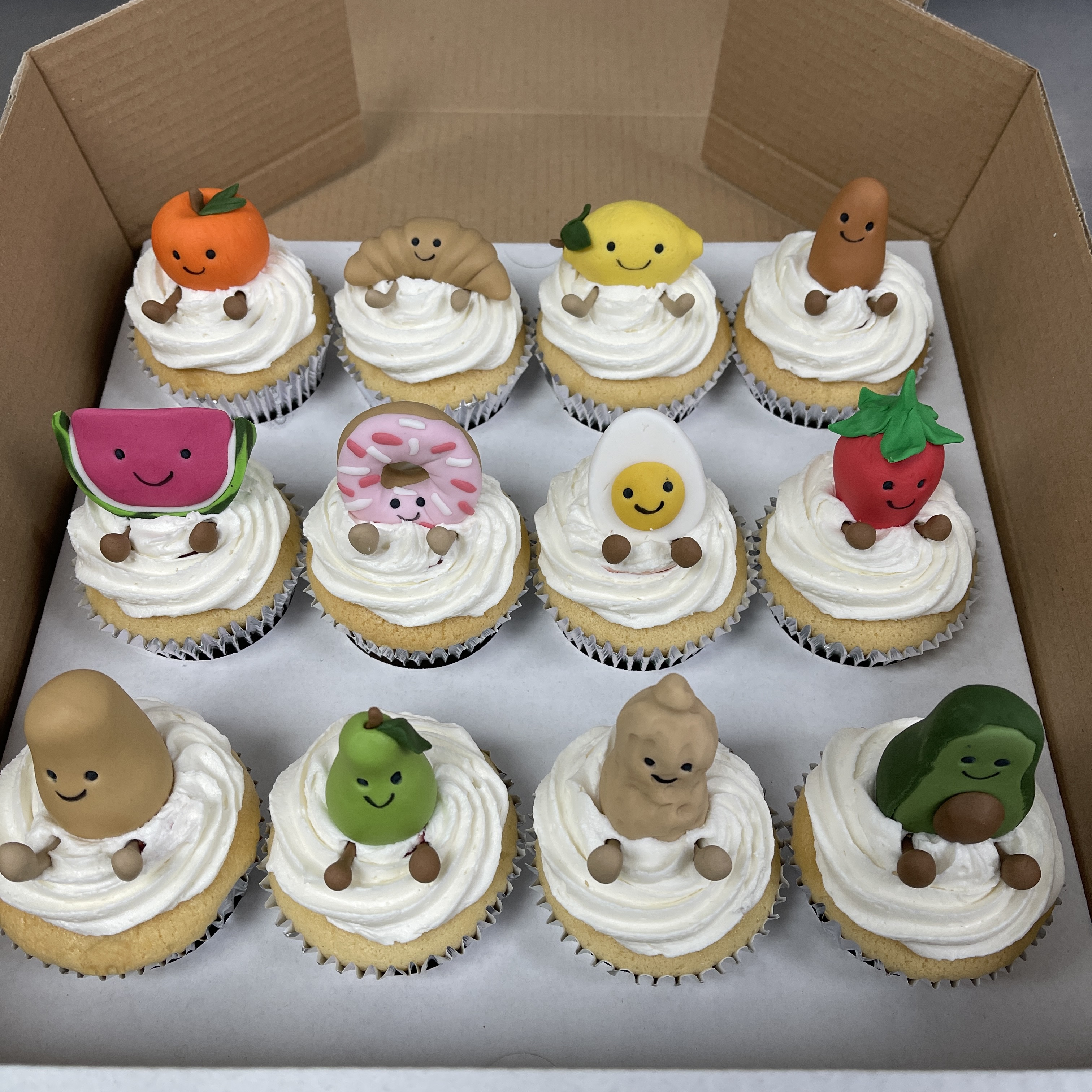 Bespoke Jellycat Amuseables cake featuring colorful plush toy designs, crafted in Solihull, West Midlands.