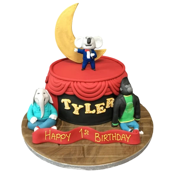 A whimsical animal-themed cake decorated with fondant animals singing on stage with red curtains, perfect for a fun and festive celebration.