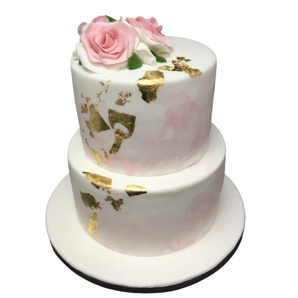 Two-tier wedding cake with pink sugar paste, gold leaf, and rose decorations.