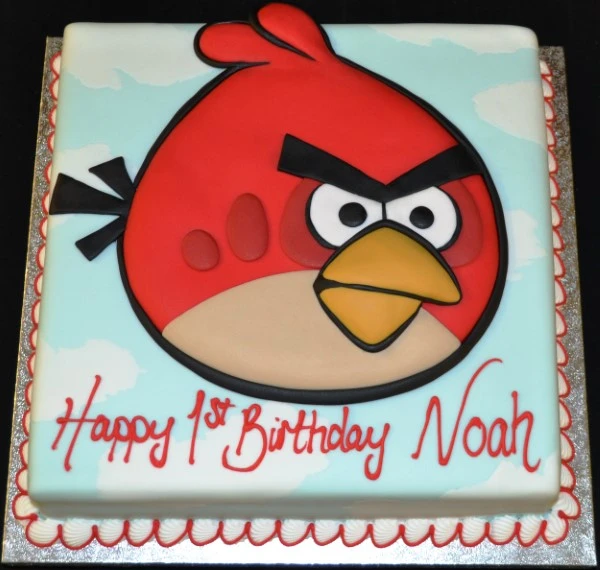 Bespoke Angry Bird cake with red bird figure on square base, crafted for celebration in Solihull, West Midlands.