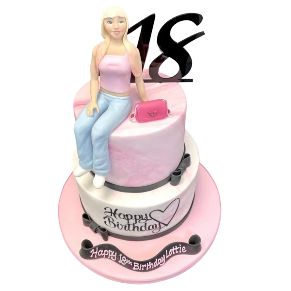 Bespoke cake featuring a detailed lady in jeans and crop top design, crafted in Solihull, West Midlands.