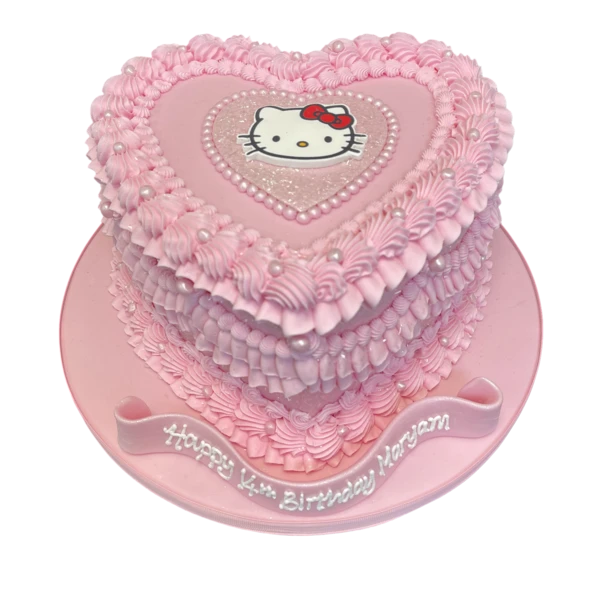 Bespoke ruffle heart-shaped cake with Hello Kitty design in Solihull, West Midlands celebration.