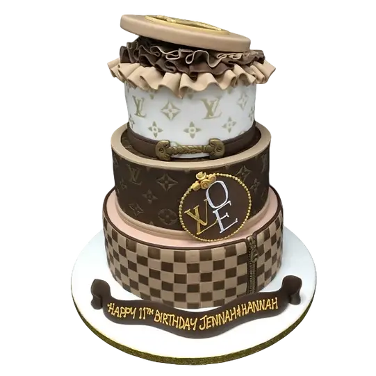 Bespoke Louis Vuitton LV logo cake with gold accents, crafted for a celebration in Solihull, West Midlands.