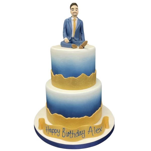Bespoke cake featuring a navy and gold man in suit design for celebration in Solihull, West Midlands.