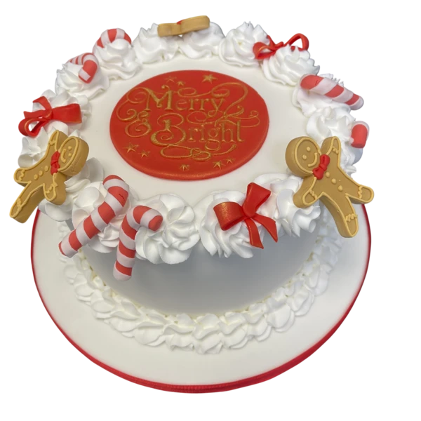 Bespoke Christmas celebration cake with candy canes and ginger men decorations in Solihull, West Midlands.