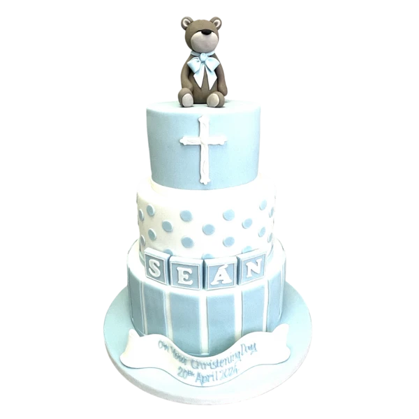 Bespoke Christening Bear cake with white icing and pastel decorations in Solihull, West Midlands.
