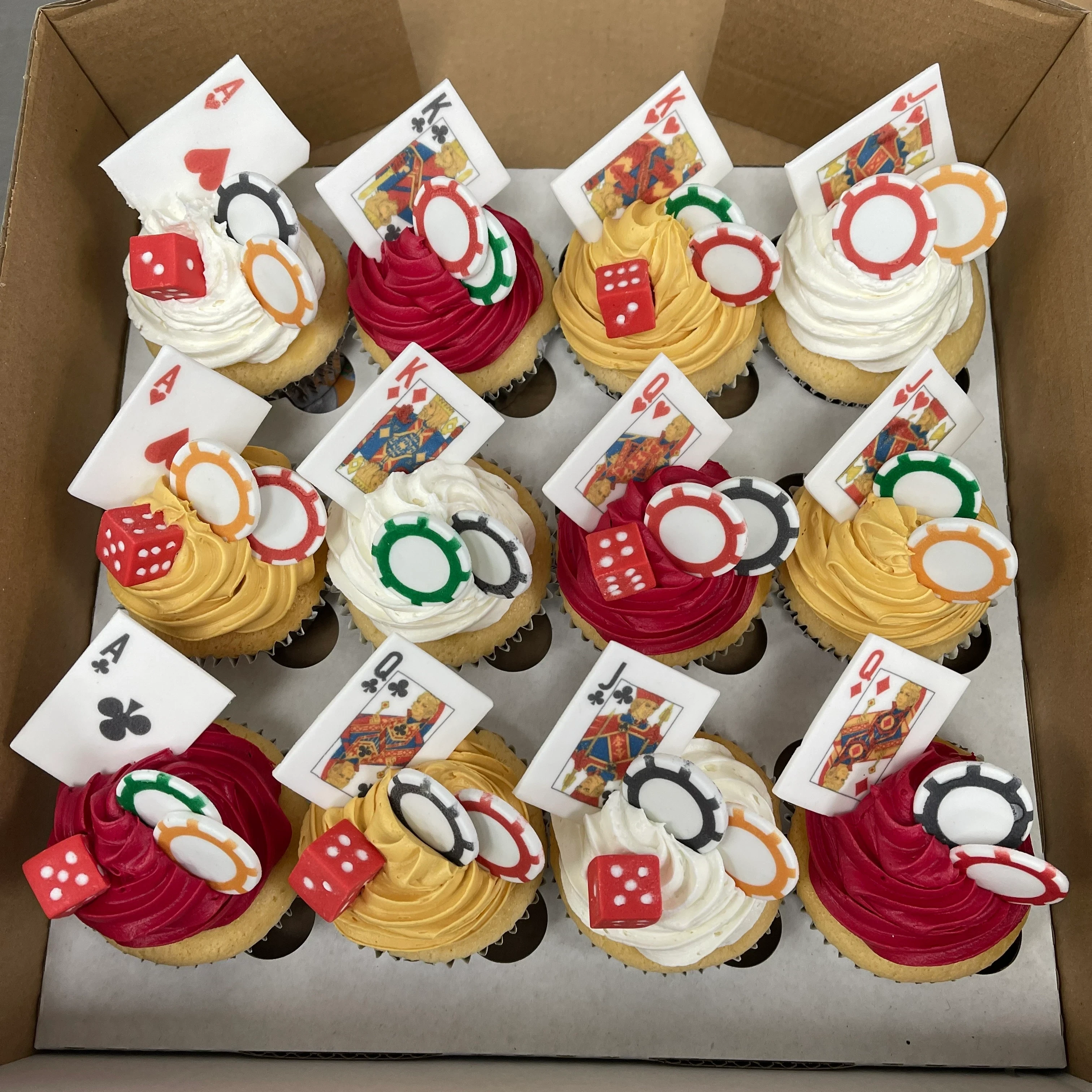Colourful Vegas themed cupcakes with vibrant decorations and sparkling details, perfect for a glamorous celebration.