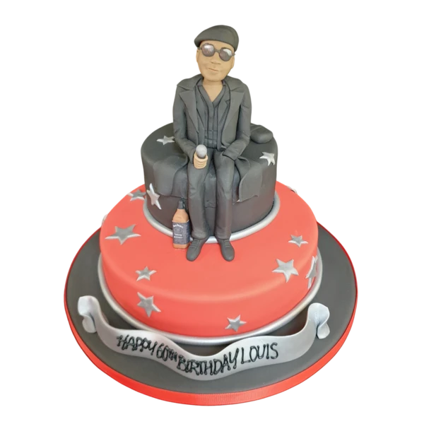 Bespoke celebration cake in Solihull, West Midlands featuring a detailed MC man holding a microphone topper.