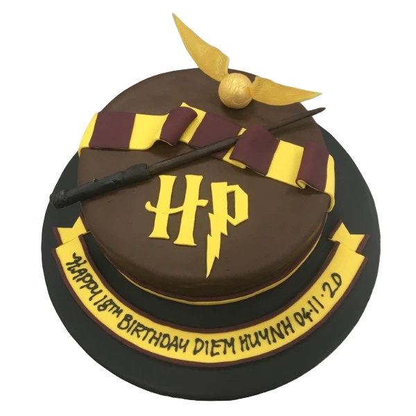 Bespoke Harry Potter-themed cake with Hogwarts crest and magical symbols, crafted in Solihull, West Midlands.