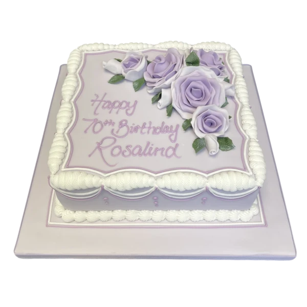 Beautiful fruit cake decorated with delicate roses, perfect for special occasions such as weddings, birthdays, and celebrations.