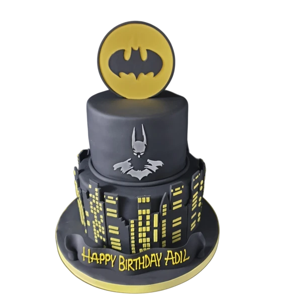 Bespoke Batman-themed cake with black and yellow accents, featuring the iconic bat symbol, Solihull, West Midlands.