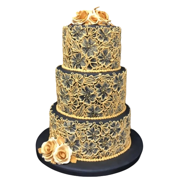 Three-tier black and gold wedding cake with floral sugar paste decorations.