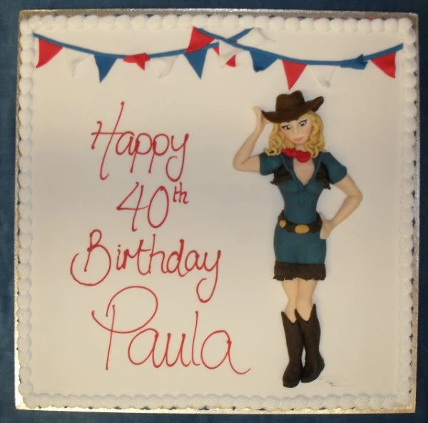 Bespoke cowgirl-themed celebration cake with detailed fondant decorations in Solihull, West Midlands.