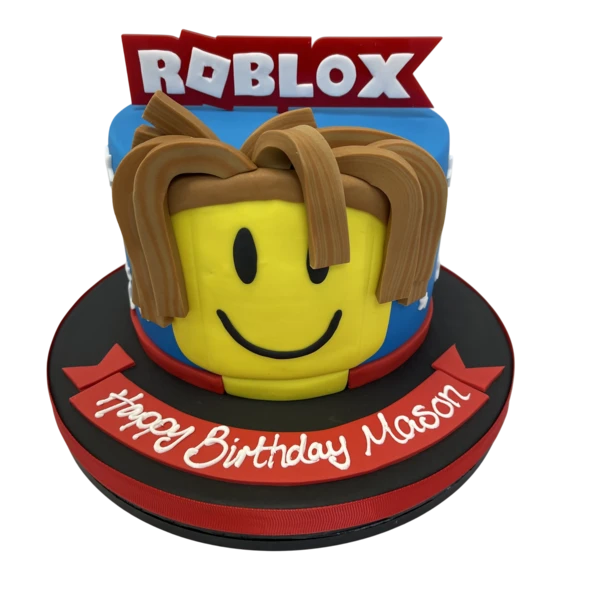 Bespoke Roblox-themed cake with colorful edible blocks and character toppers in Solihull, West Midlands.