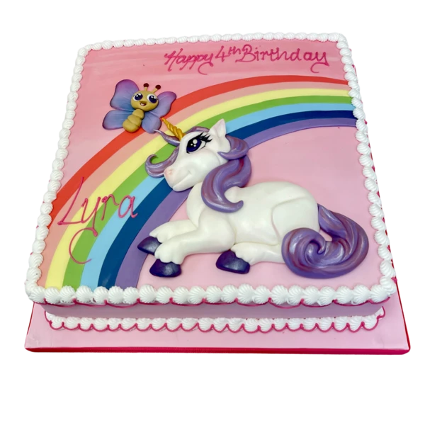 Bespoke celebration cake with unicorn, butterfly, and rainbow decorations in Solihull, West Midlands.