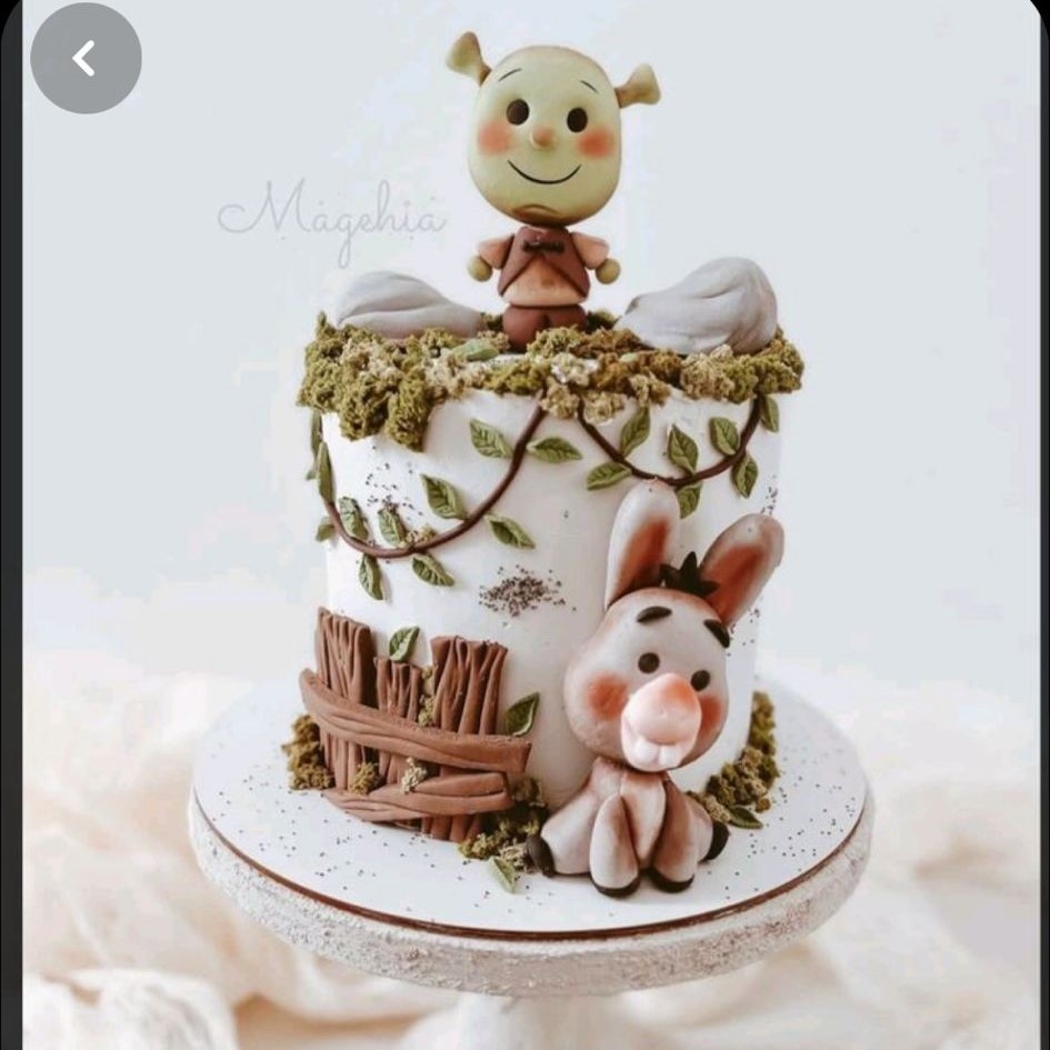 Bespoke celebration cake with intricate floral icing and gold accents, crafted in Solihull, West Midlands.