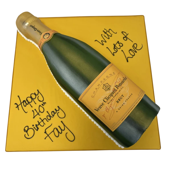 Bespoke cake shaped like a Veuve Clicquot champagne bottle, decorated with realistic label details in Solihull, West Midlands.