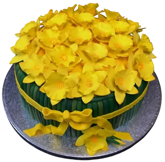 Bespoke celebration cake with vibrant yellow daffodils and green leaves, crafted in Solihull, West Midlands.
