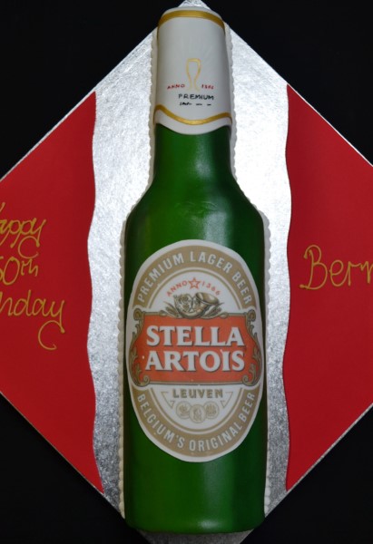 Bespoke cake shaped like a Stella Artois bottle with detailed label, crafted for celebration in Solihull, West Midlands.