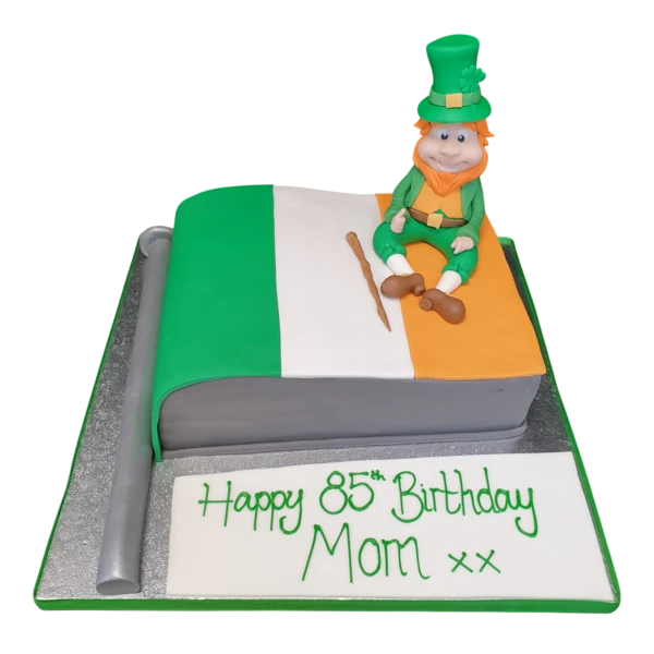 Bespoke cake featuring a leprechaun sitting on an Irish flag, crafted for celebration in Solihull, West Midlands.